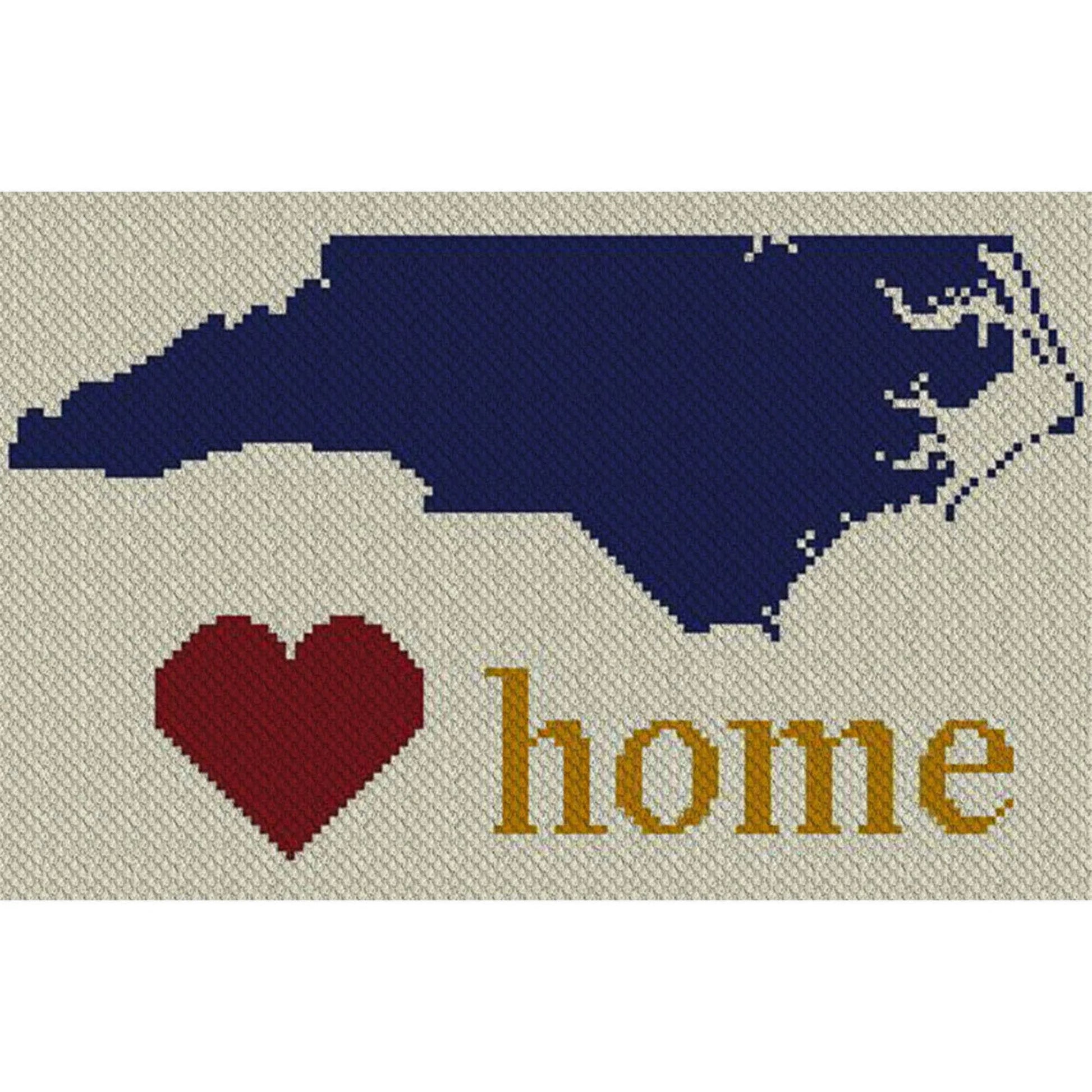 Pixel-art North Carolina outline in four coordinating yarn blocks