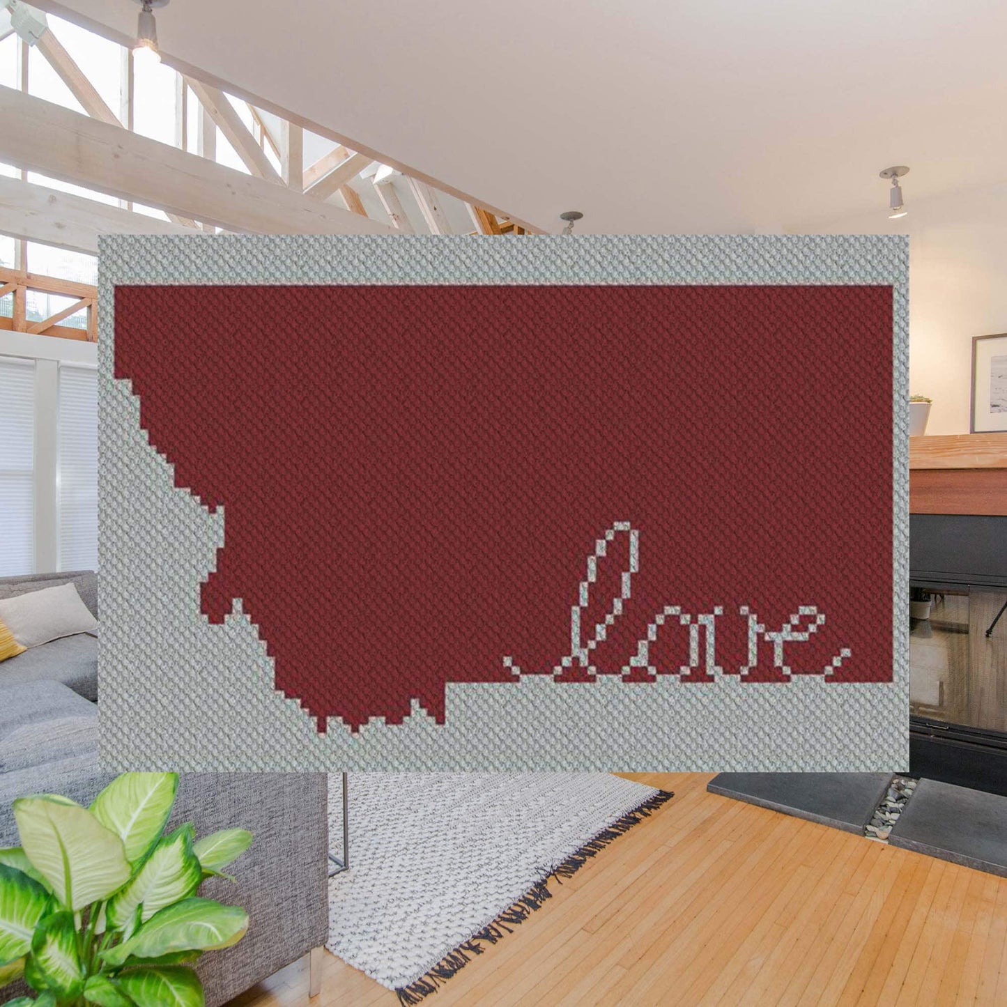 Pixel-art Montana outline with a heart in two contrasting yarn blocks