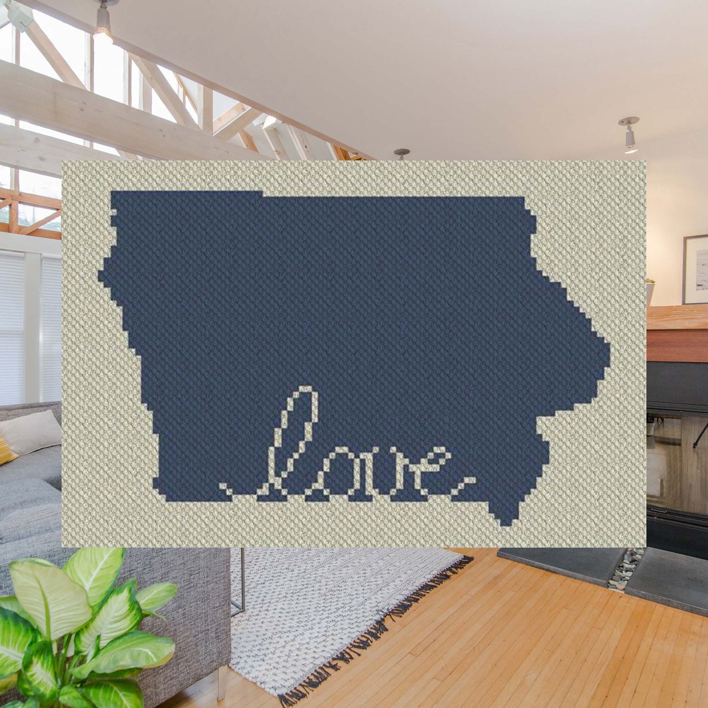 Pixel-art Iowa outline with heart motif in two contrasting yarn blocks