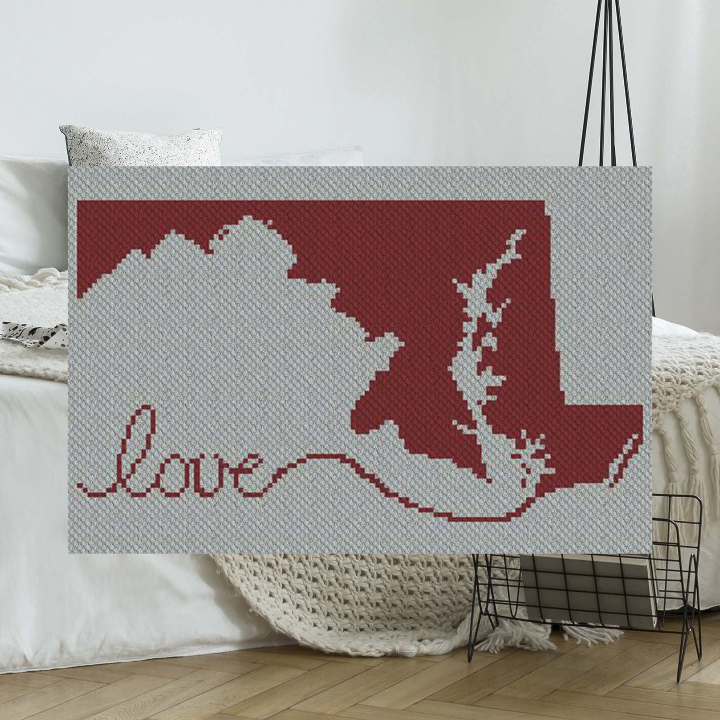 Pixel-art Maryland silhouette with a heart in two contrasting yarn blocks