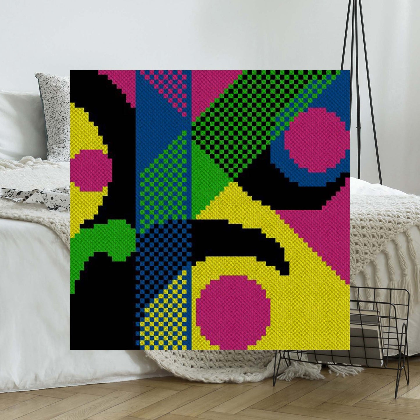 Neon pink, yellow, green, and blue geometric blocks forming an '80s–style checker-and-arc pattern in C2C blocks