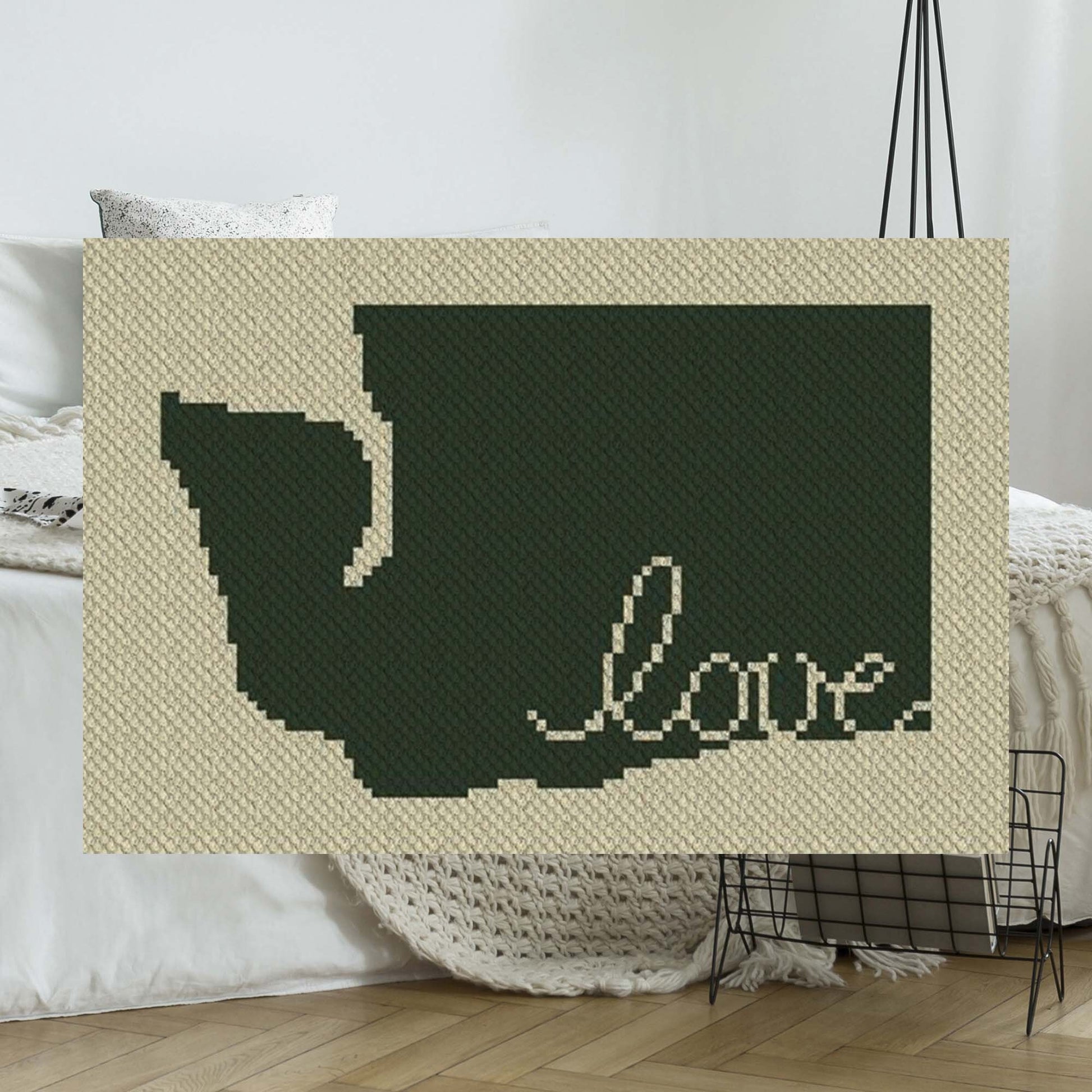 Pixel-art Washington outline with heart motif in two contrasting yarn blocks