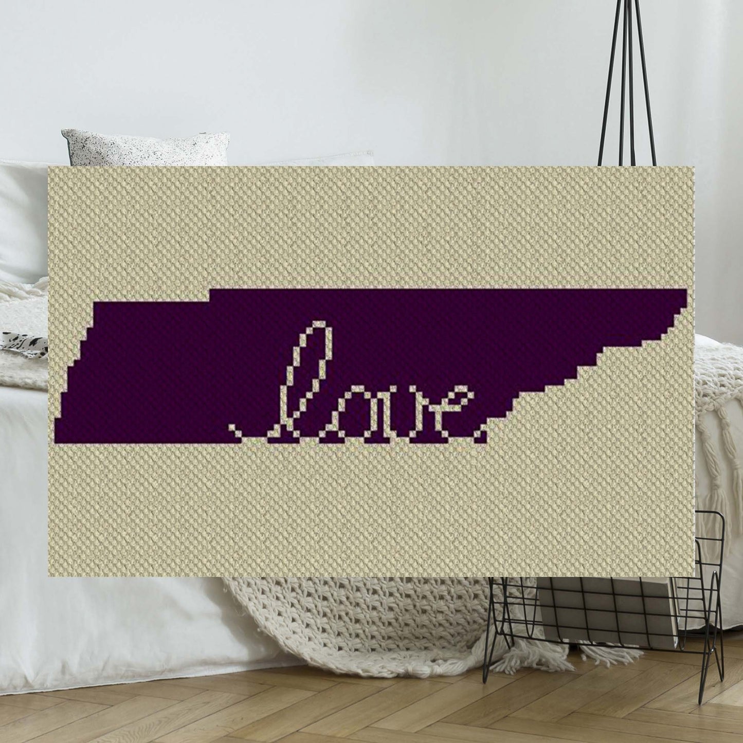 Pixel-art Tennessee state outline with a heart motif in two contrasting yarn colors