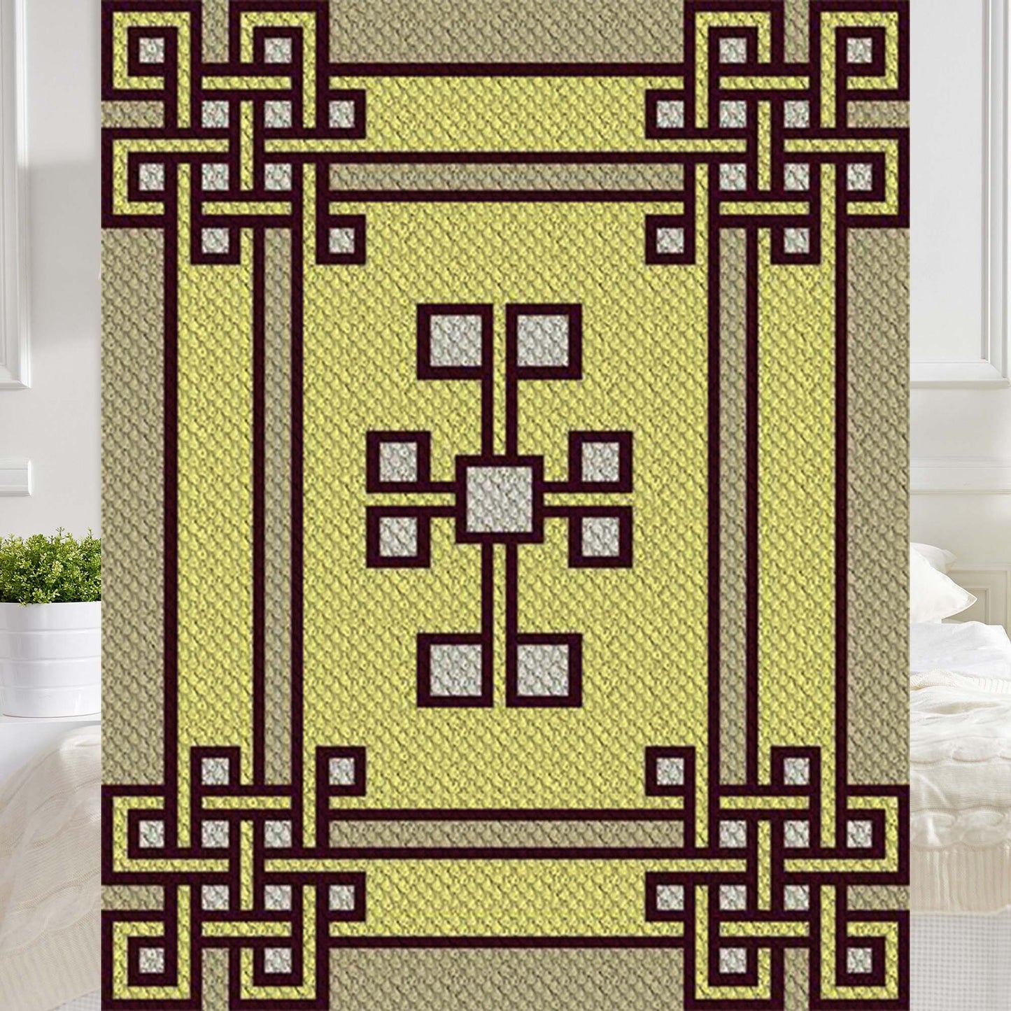 Interlaced box knot motif in cream, gold, and burgundy yarn blocks