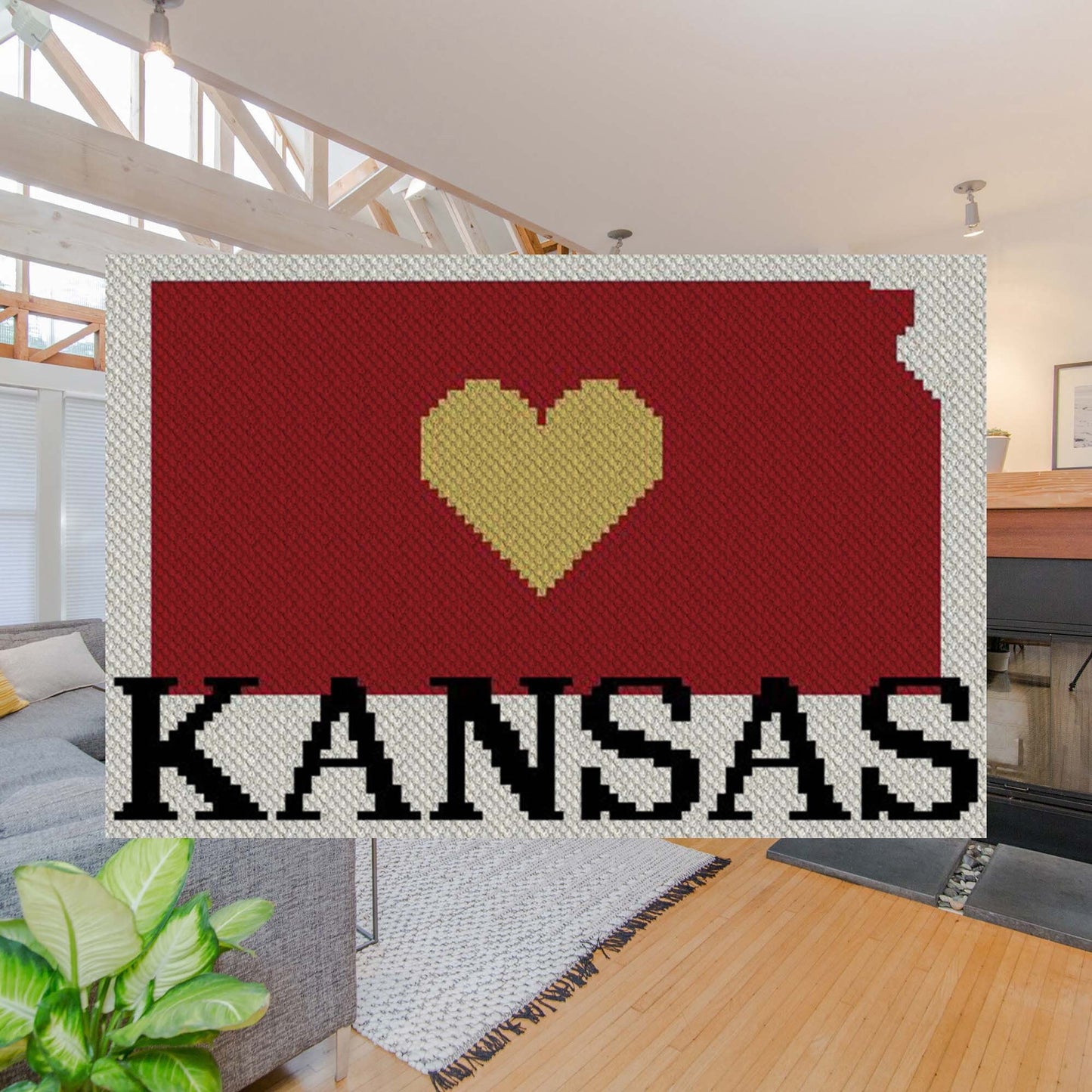 Pixel-art Kansas map outline with heart in the center in four yarn colors