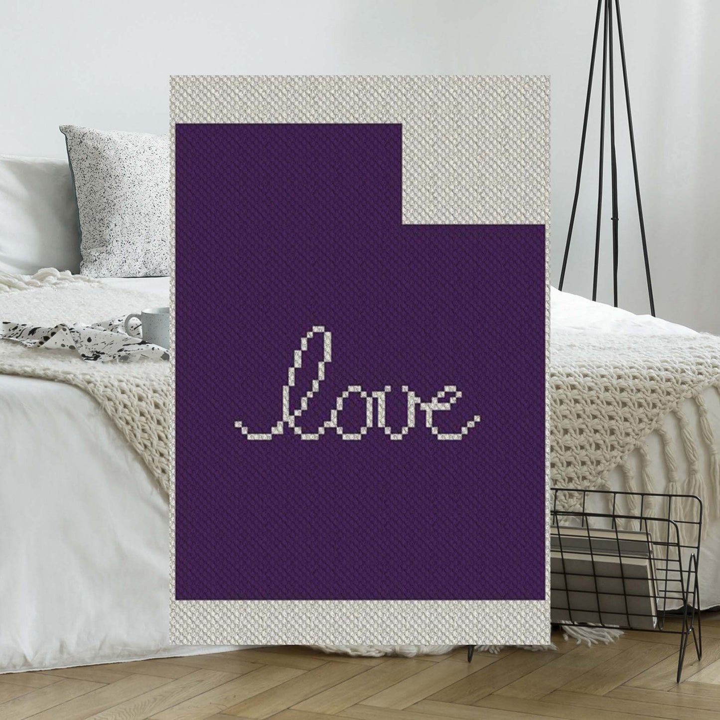 Pixel-art Utah outline with heart motif in two contrasting yarn blocks