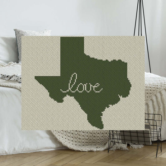 Pixel-art Texas state outline with a bold heart motif in two contrasting yarn colors