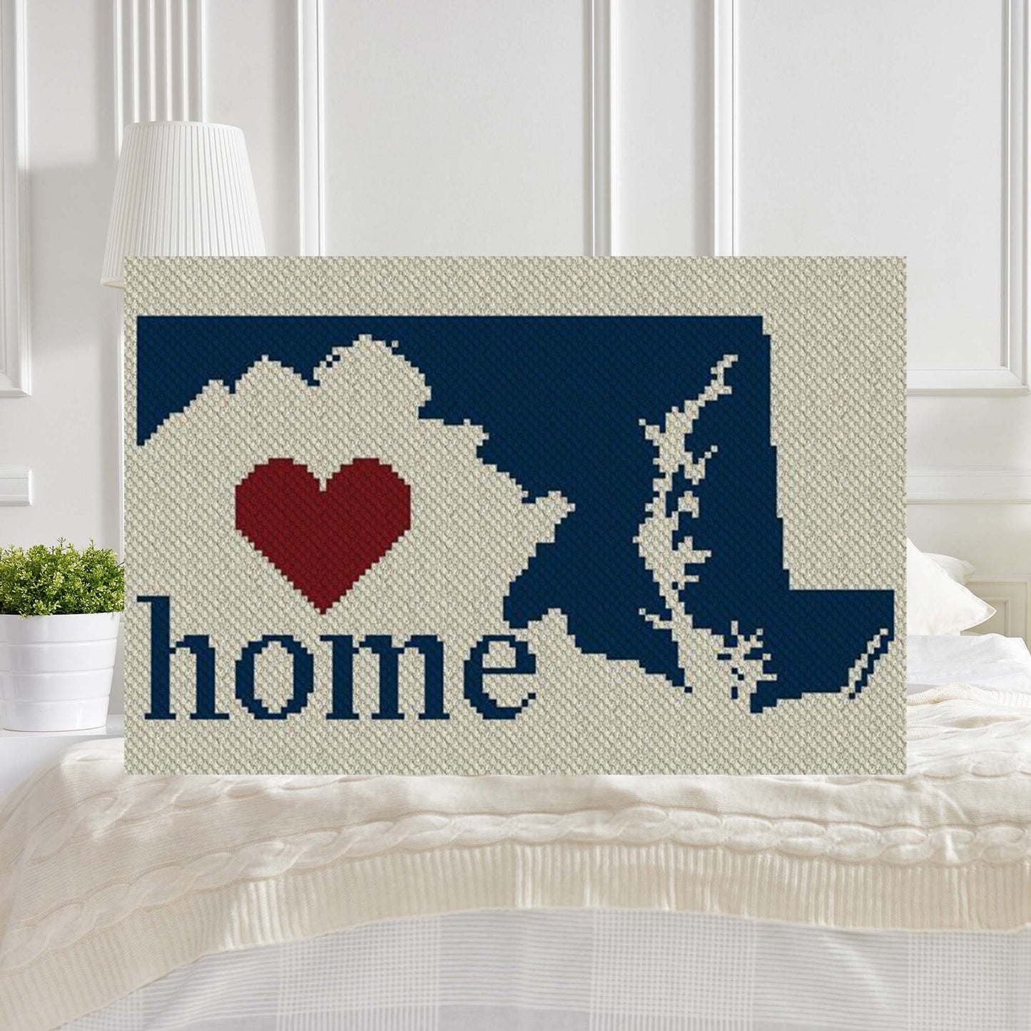 Pixel-art Maryland silhouette in three vibrant yarn blocks