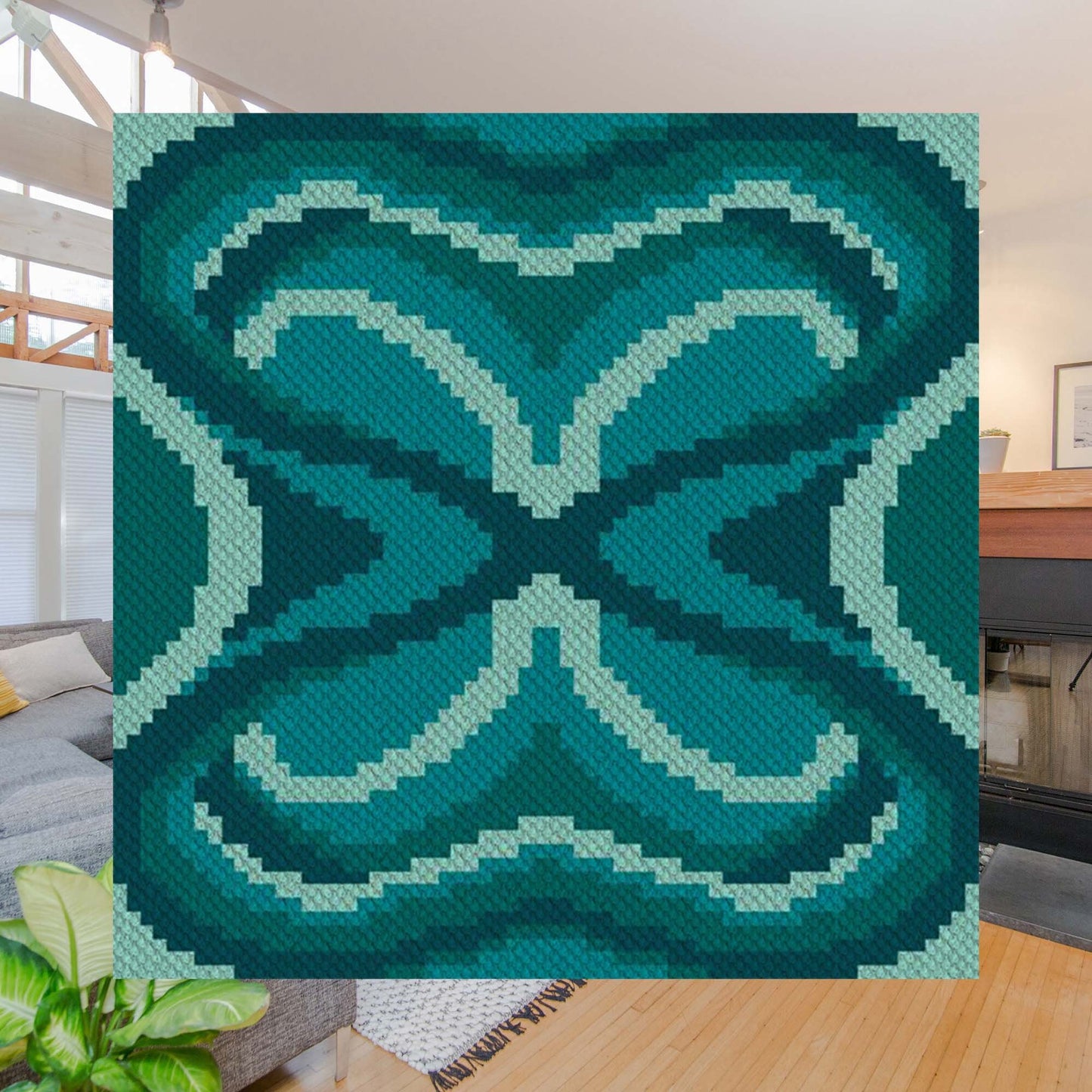 Abstract radial motif in deep teal, aqua, and light mint forming a stylized moth wing pattern