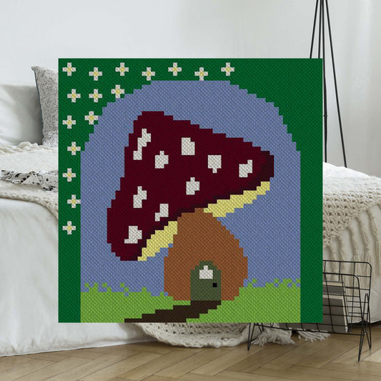 Whimsical C2C crochet forest scene with toadstools and fairies in vibrant yarn colors