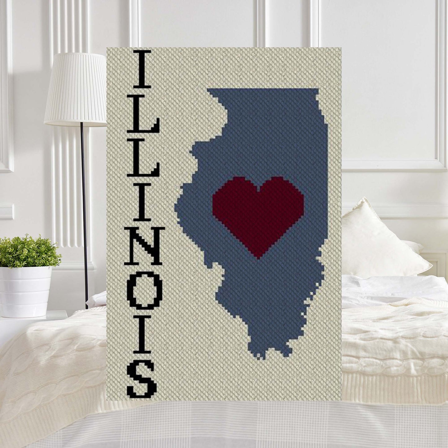 Pixel-art Illinois map outline with a heart in four vibrant yarn blocks