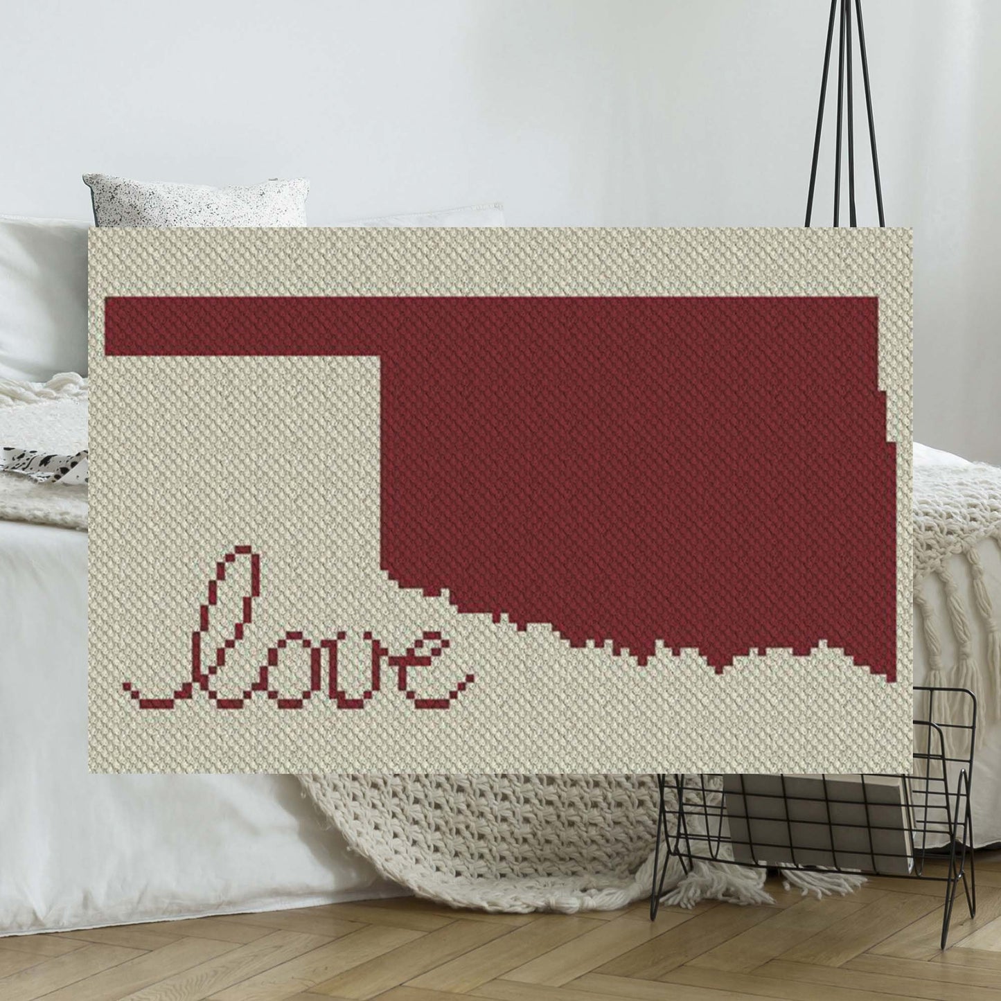 Pixel-art Oklahoma outline with heart motif in two contrasting yarn blocks