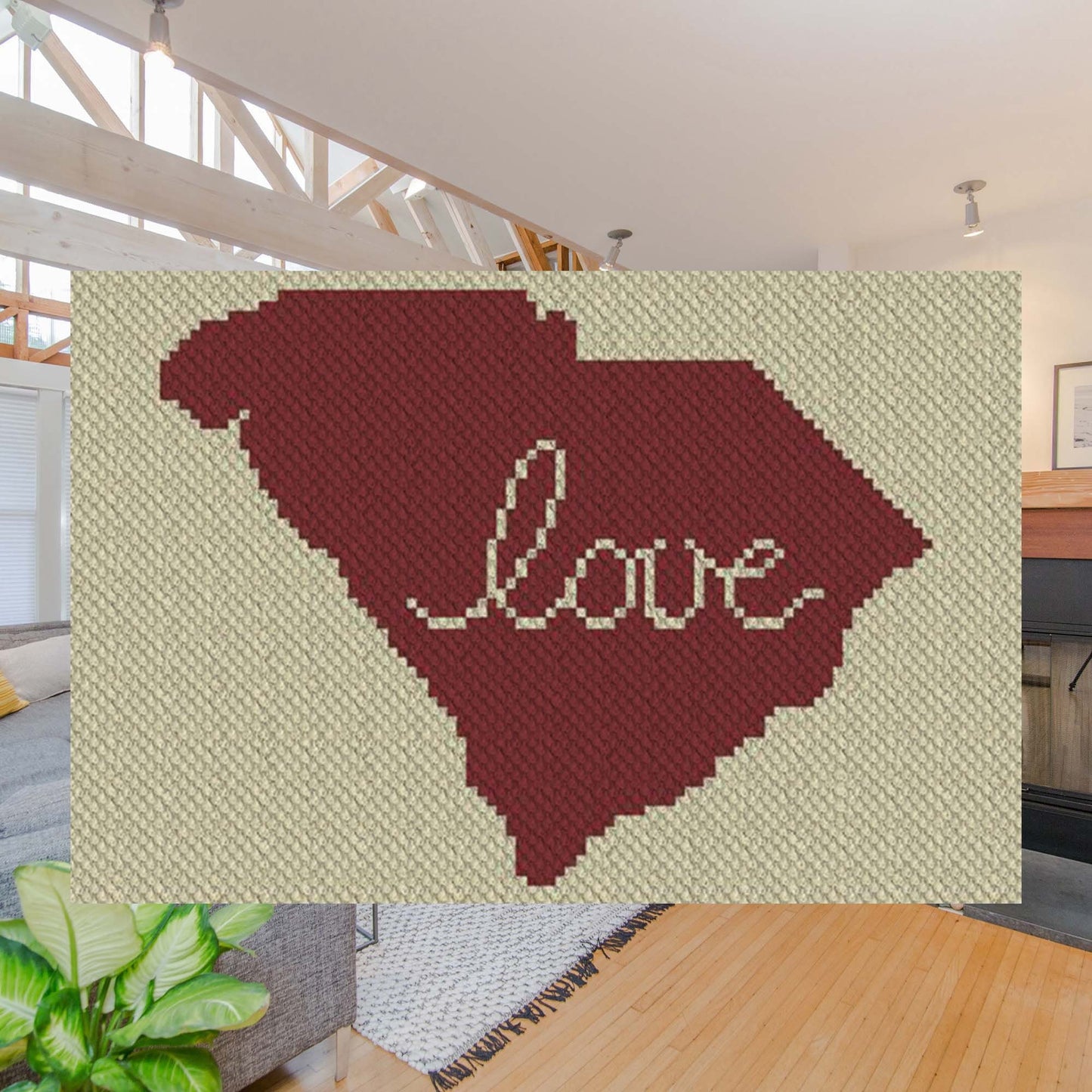 Two-color pixel-art outline of South Carolina with a heart motif