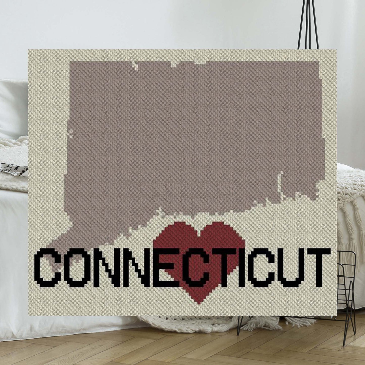 Pixel-art Connecticut outline with a heart motif in C2C blocks