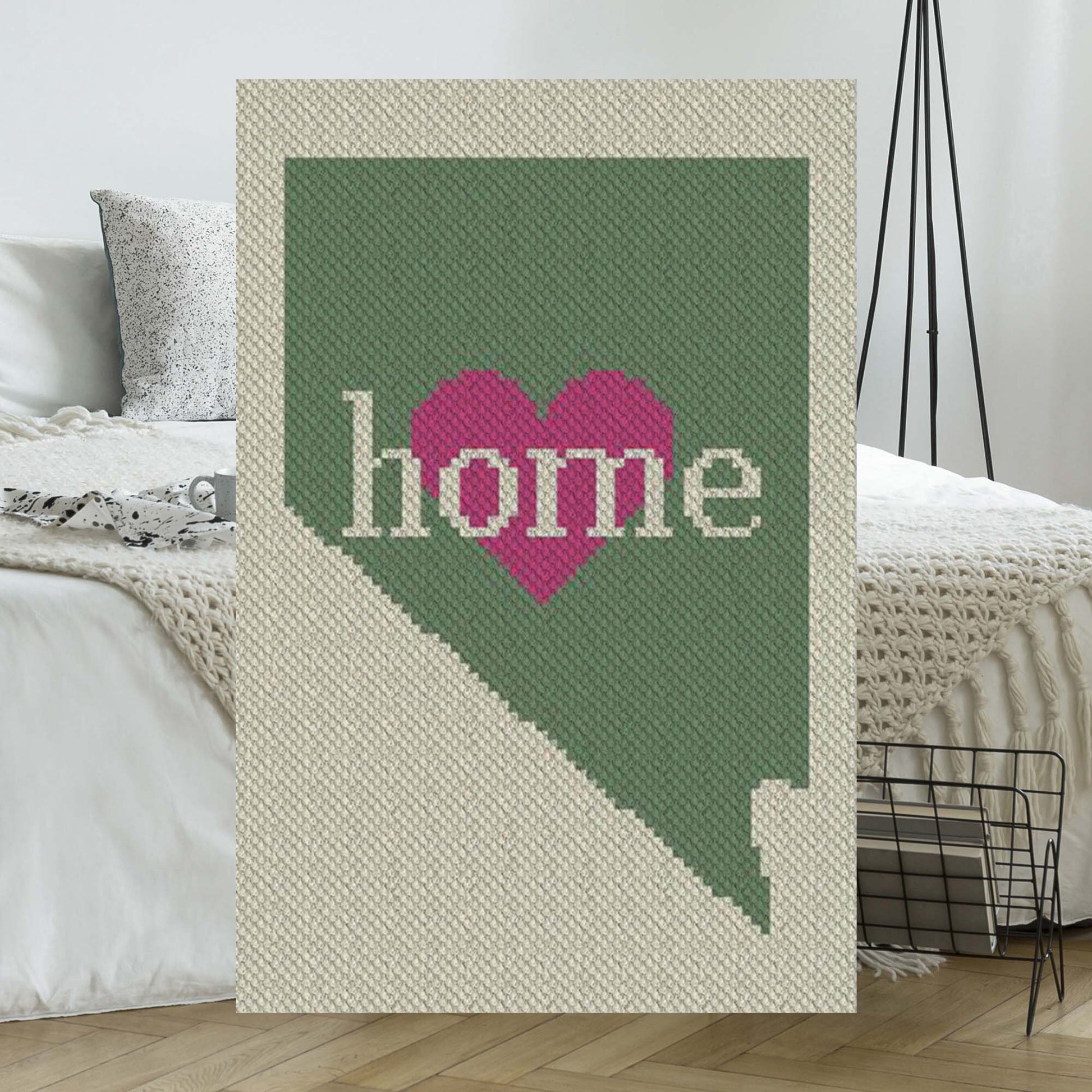 Pixel-art Nevada outline in three coordinating yarn blocks