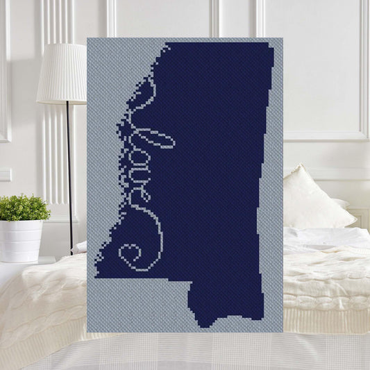 Pixel-art Mississippi outline with a centered heart in two contrasting yarn blocks