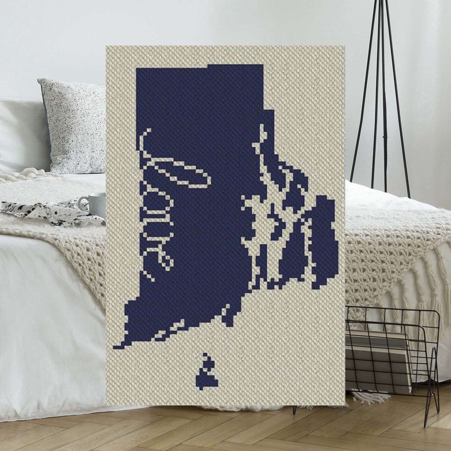 Pixel-art Rhode Island outline with heart motif in two contrasting yarn blocks