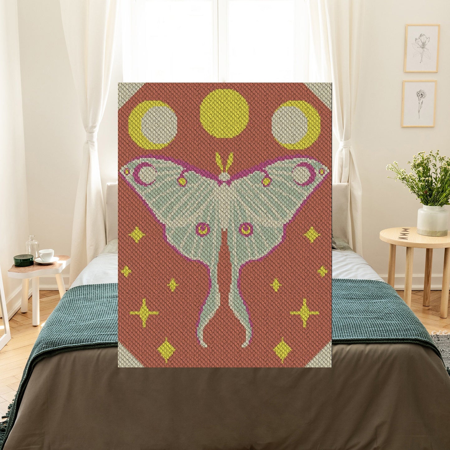 Stylized Luna Moth with outstretched wings beneath three lunar phases, surrounded by star motifs in soft earth tones
