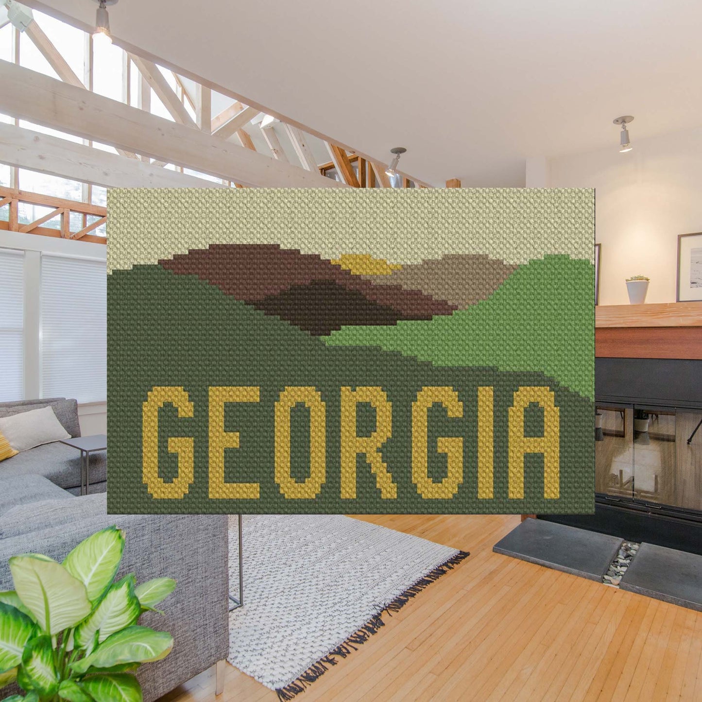 Pixel-art peaks in shades of green, purple, blue, and pink with GEORGIA†spelled beneath