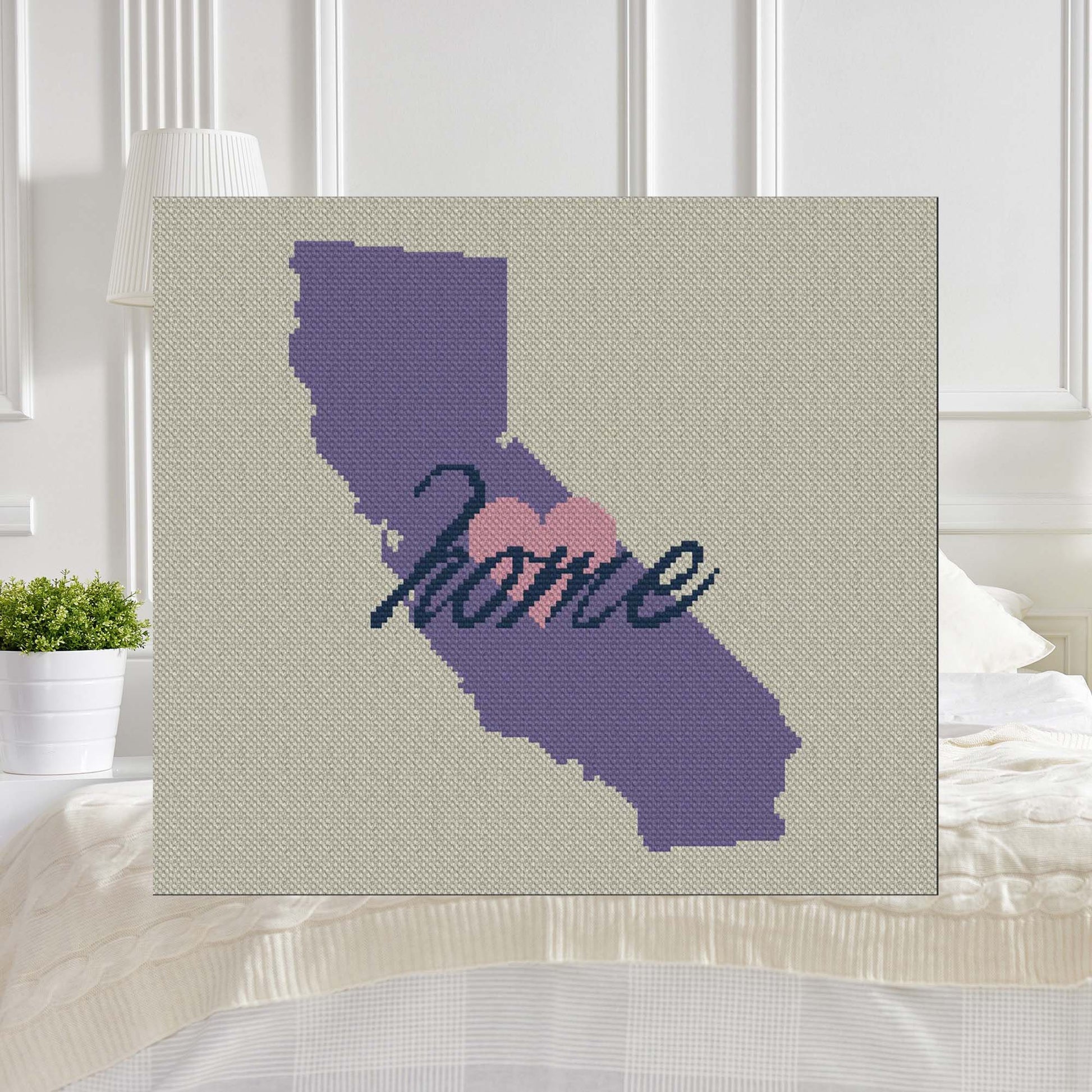 Pixel-art California silhouette with coast, mountains, and King†scale overlay in yarn blocks