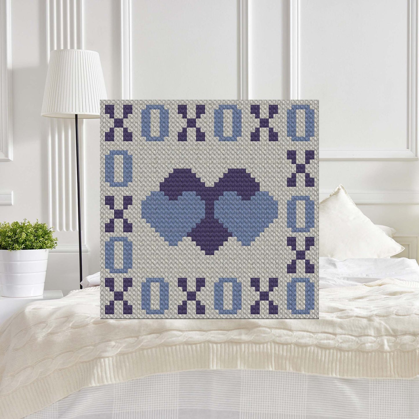 Grid of corner-to-corner hearts and XOXO border in three colors (pink, yellow, blue) against a neutral background