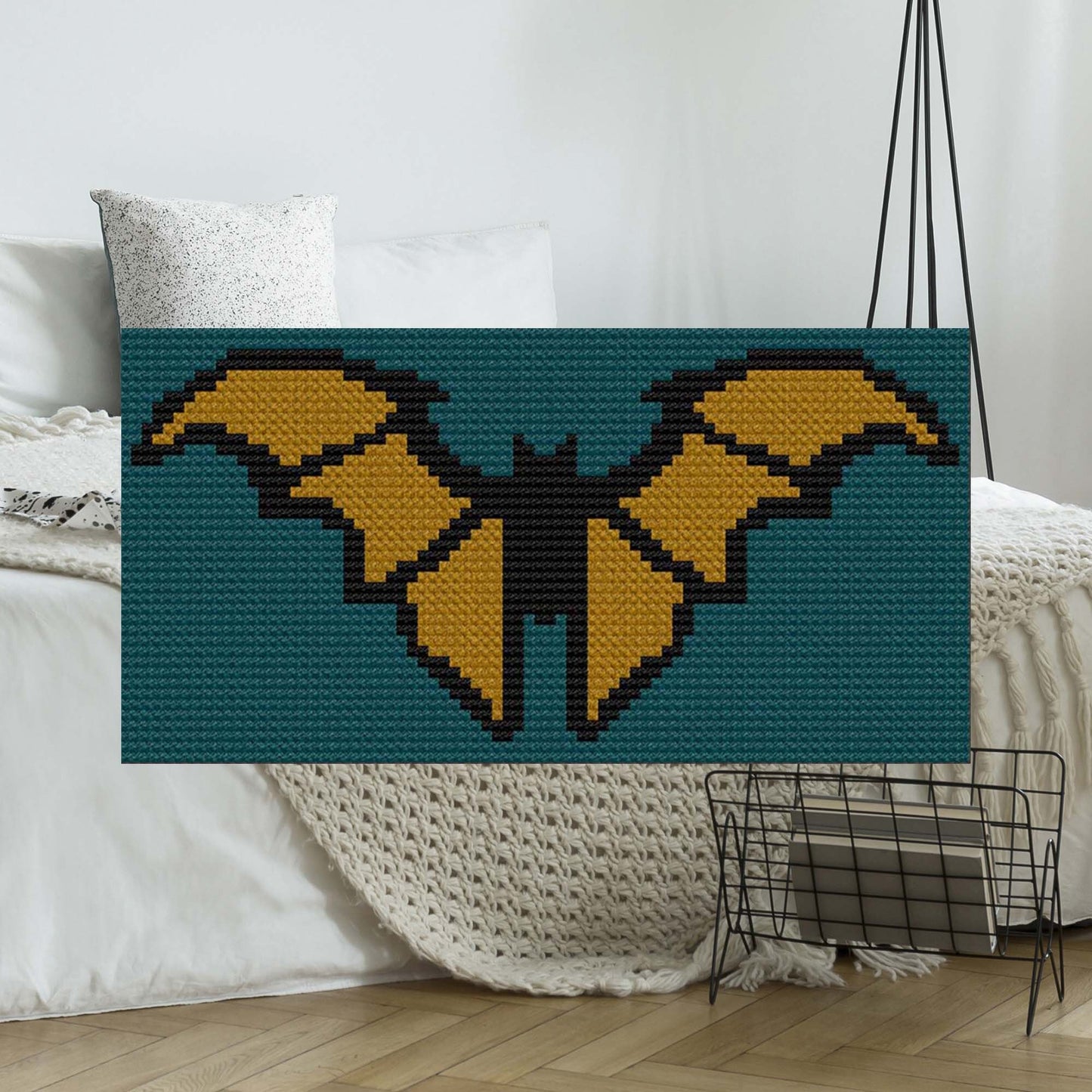 Pixel-art bat silhouette in orange, black, and taupe on a teal background
