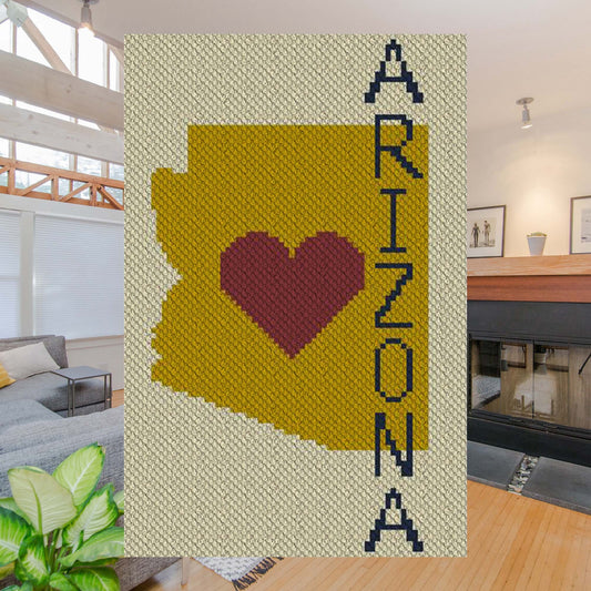 Pixel-art Arizona state shape with heart in contrasting layers of yarn blocks